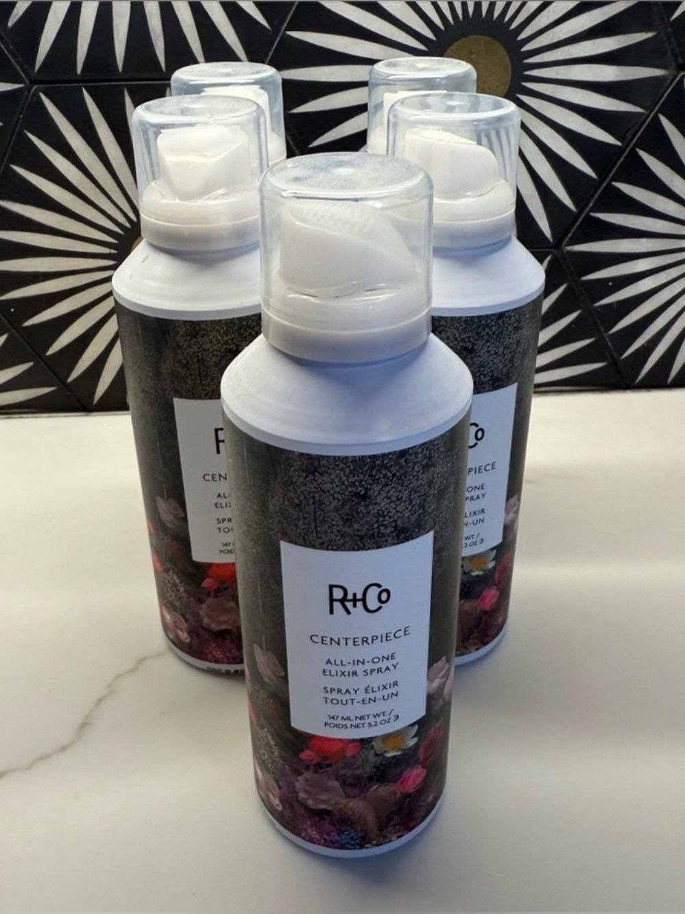 R+Co Centerpiece All-In-One Elixir Spray — White